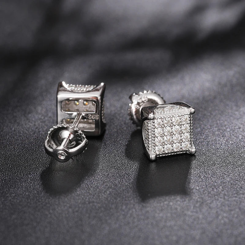 Iced Out Box Studs made of 925 Sterling Silver and VVS1 Moissanite,Material: 925 Sterling Silver Stone: VVS1 Moissanite Introducing our Iced Out Box Studs, meticulously crafted from 925 Sterling Silver and adorned with dazzling VVS1 Moissanite stones. The