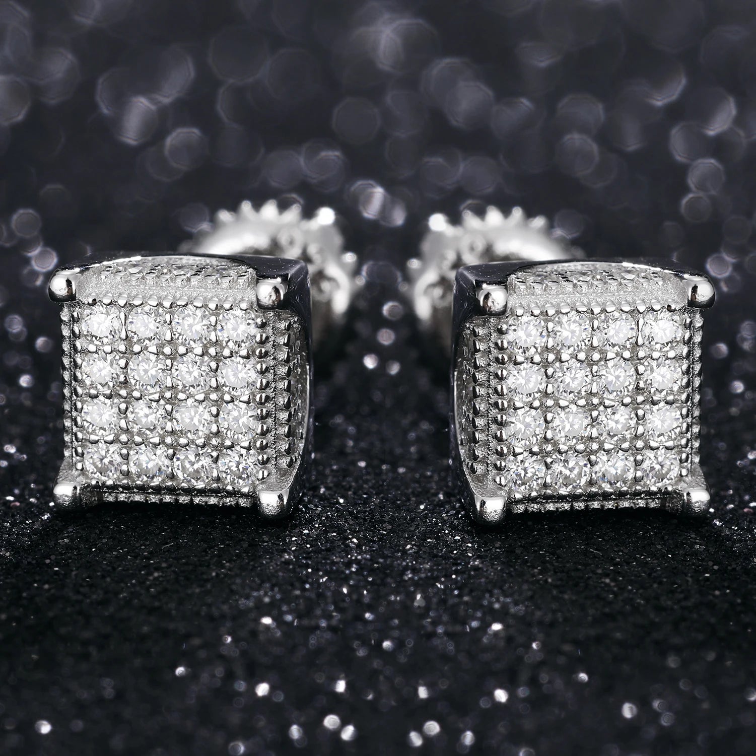 Iced Out Box Studs made of 925 Sterling Silver and VVS1 Moissanite,Material: 925 Sterling Silver Stone: VVS1 Moissanite Introducing our Iced Out Box Studs, meticulously crafted from 925 Sterling Silver and adorned with dazzling VVS1 Moissanite stones. The