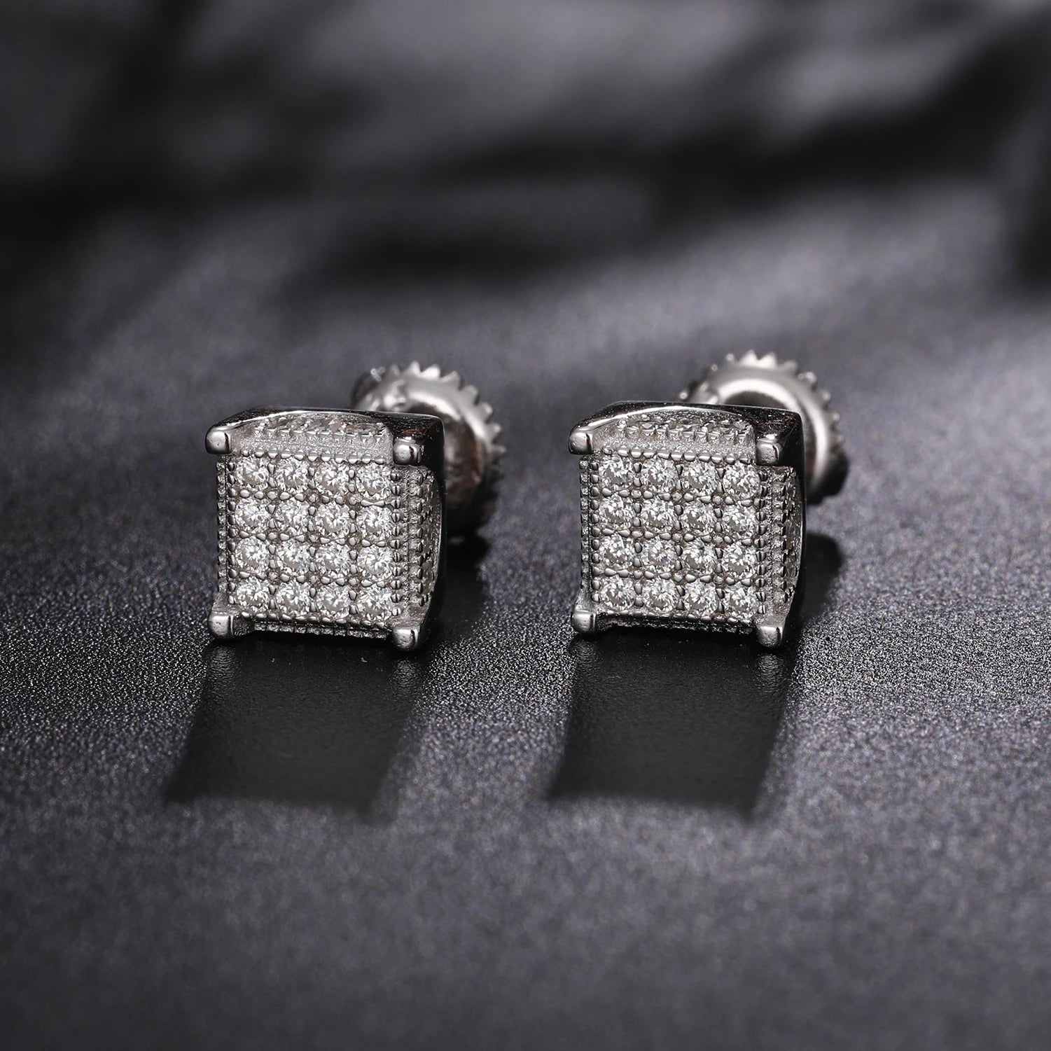 Iced Out Box Studs made of 925 Sterling Silver and VVS1 Moissanite,Material: 925 Sterling Silver Stone: VVS1 Moissanite Introducing our Iced Out Box Studs, meticulously crafted from 925 Sterling Silver and adorned with dazzling VVS1 Moissanite stones. The