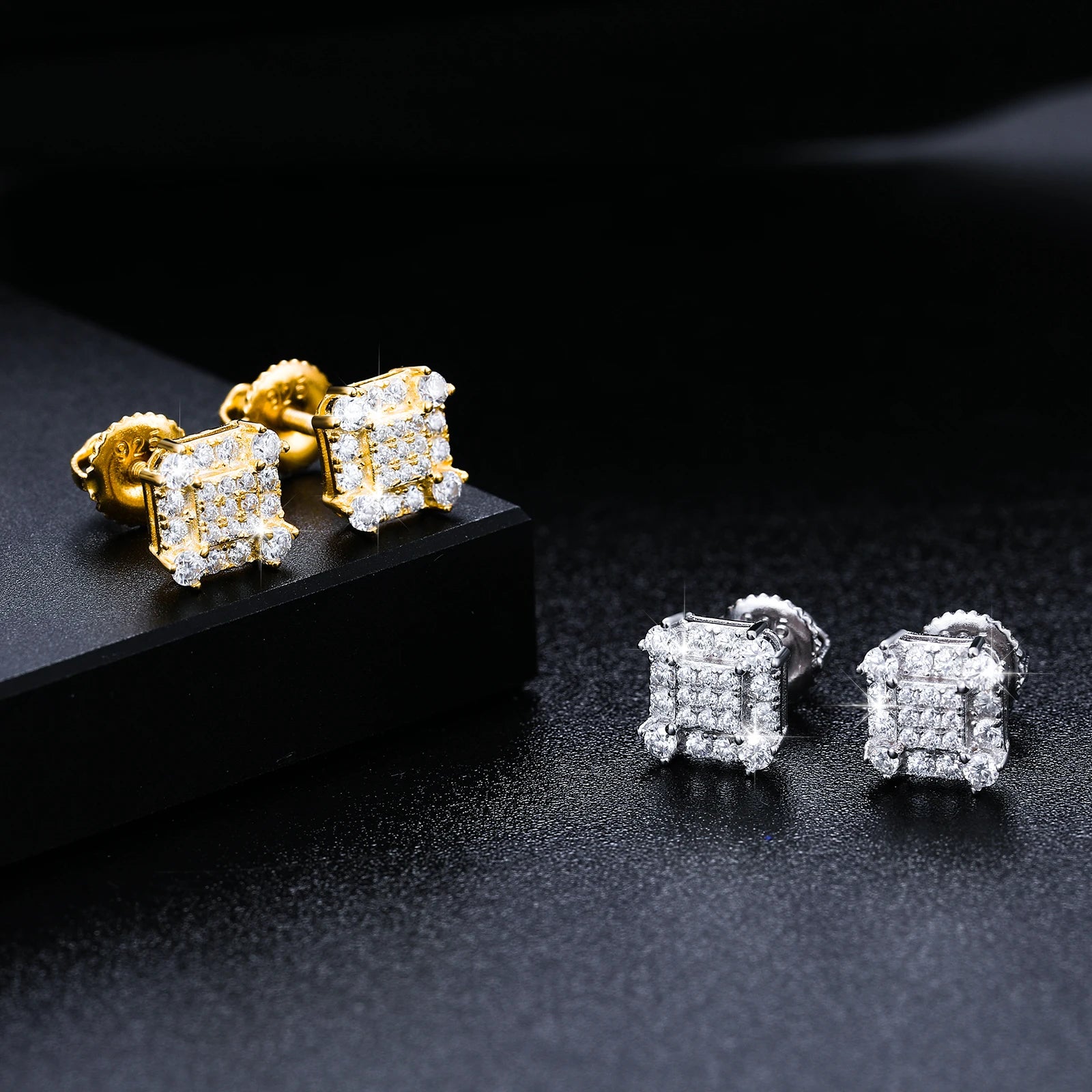 Iced Out Square Studded Studs made with 925 Sterling Silver and VVS1 Moissanite (24K Gold Plating),Material: 925 Sterling Silver Stone: VVS1 Moissanite Plating: 24K Gold Plating or Silver Add a touch of luxury to your jewelry collection with our Iced Out